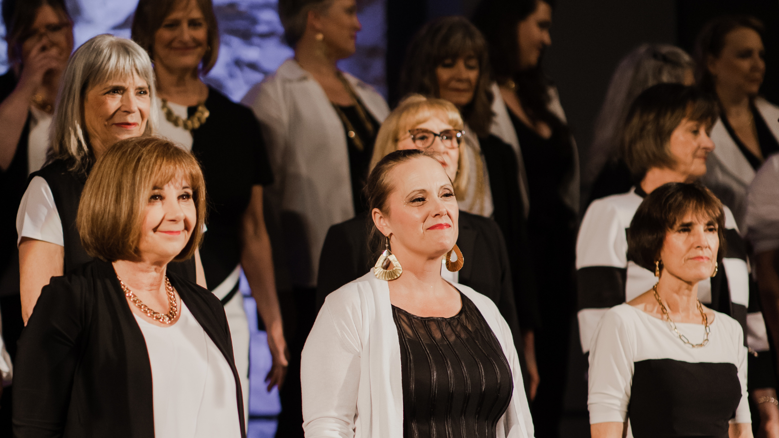 Members of the She's Up2Something choir performing in 2022.